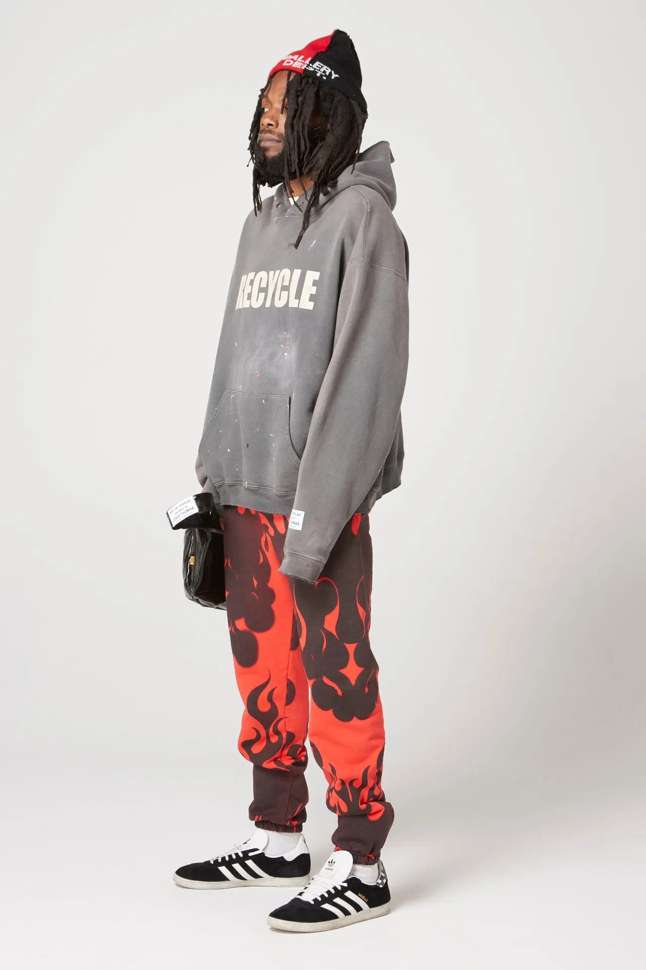 GALLERY DEPT. 90'S RECYCLE HOODIE WASHED BLACK 90'S washed hoodie with distressed eco-friendly slogans. Washed black S-XL. Ready-made garments are washed and dyed again. Multiple spots throughout the body are spray-faded. The ribs are cut and worn.